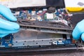 Hands of a technician repairing a broken laptop computer Royalty Free Stock Photo