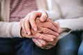 Hands of teenage girl and her grandmother at home. Royalty Free Stock Photo