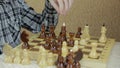 Hands of teenagers playing chess