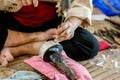 Hands of Thailander demonstration of Carved silver water bowl at Chiang Mai, Thailand Royalty Free Stock Photo