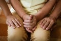 Hands of three generations close up