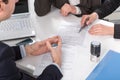 Hands of three people, signing documents Royalty Free Stock Photo