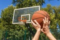 Hands throwing basketball ball Royalty Free Stock Photo