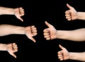 Hands with thumbs up and down. Like and dislike signs. Isolated on black background