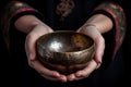 Hands with Tibetan singing bowl. Generate ai