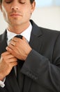 Hands, tie and a business man getting ready for work or to start a new job as a corporate employee. Style, suit and