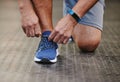 Hands, tie shoes and fitness in gym to start workout, training or exercise for wellness. Sports, athlete and man tying Royalty Free Stock Photo