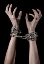 Hands tied chain, kidnapping, dependence, loneliness, social problem, halloween theme, black background Royalty Free Stock Photo