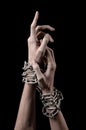 Hands tied chain, kidnapping, dependence, loneliness, social problem, halloween theme, black background Royalty Free Stock Photo