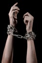 Hands tied chain, kidnapping, dependence, loneliness, social problem, halloween theme, black background Royalty Free Stock Photo