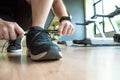 Hands are tied with shoes that are ready to exercise in the fitness center Royalty Free Stock Photo