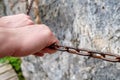 Hands to cling to the chain in the rock hands weathered Royalty Free Stock Photo