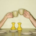 Hands toasting cups. Royalty Free Stock Photo