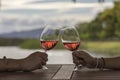 Hands toasting wine