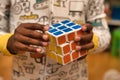 Hands of toddler in Pajamas holding a solved white RubikÃ¢â¬â¢s cube