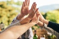 Hands together, high five and support of family, friends or people in prayer, motivation and unity in a summer garden Royalty Free Stock Photo