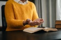 Hands together in prayer to God along with the bible In the Christian concept and religion, woman pray in the Bible on the wooden Royalty Free Stock Photo