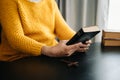 Hands together in prayer to God along with the bible In the Christian concept and religion, woman pray in the Bible on the wooden Royalty Free Stock Photo