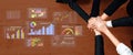 Hands Together on a Workspace Surrounded by Digital Graphs and Charts Representing Data Analysis and Team Collaboration Royalty Free Stock Photo