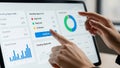 Hands interacting with a digital dashboard showing pending approvals and charts interface Royalty Free Stock Photo