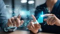 Close-up of hands interacting with a futuristic digital interface displaying financial data Royalty Free Stock Photo