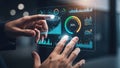 Hands interacting with a futuristic holographic display showing financial data and charts Royalty Free Stock Photo