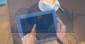 Hands touching digital tablet with overlay Royalty Free Stock Photo