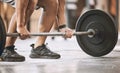 hands of trainer lifting a heavy barbell. Bodybuilder ready to lift weights cropped. Muscular athlete ready to workout