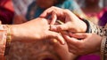 Couple hands ring ceremony, a Hindu wedding ritual