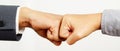 Hands of  two business people wear making a fist pump together after good deal. success and show Royalty Free Stock Photo