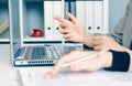 Hands of two business women sitting together and working on laptop. Executives meeting in a office lobby. Woman pointing Royalty Free Stock Photo