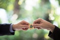 Hands of two businessmen are trading coin of bitcoin. A symbolic coins of bitcoin. electronic money exchange, Business,