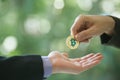 Hands of two businessmen are trading coin of bitcoin. A symbolic coins of bitcoin. electronic money exchange, Royalty Free Stock Photo