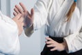 Hands of two girls practice Aikido on martial arts training Royalty Free Stock Photo