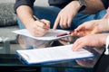 Two people signing a document