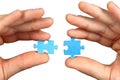 Hands with two puzzles Royalty Free Stock Photo