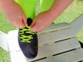 Hands Tying Shoelaces on Soccer Football Cleats