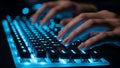Person typing on a blue backlit mechanical keyboard for gaming or programming at night Royalty Free Stock Photo