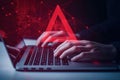 Hands type on laptop computer keyboard. Red warning sign on screen. Cybersecurity concept. Network attack alert. Person works on
