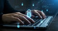 Hands type on a laptop keyboard with floating digital padlock icons symbolizing