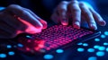 Hands type on lit screen illuminated by colorful neon lights Royalty Free Stock Photo