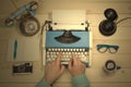 Hands on typewriter at the office desk. Flat lay. Royalty Free Stock Photo