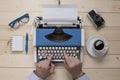 Hands on typewriter on the office desk Royalty Free Stock Photo