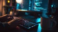 Person typing on illuminated keyboard with code on computer screen Royalty Free Stock Photo