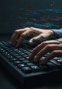Hands typing on a black keyboard with digital code and data visualizations floating Royalty Free Stock Photo