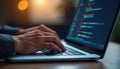 Hands typing code on laptop keyboard, software development, programming. Royalty Free Stock Photo
