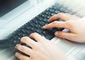 Hands Typing on Computer Keyboard at Office