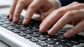 Hands Typing on Computer Keyboard in Office Environment with Focus on Fingers and Keys Royalty Free Stock Photo