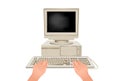 Hands are typing on computer keyboard. Online workplace behind retro pc.