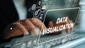 Hands Typing on Keyboard with Data Visualization Graphics and Digital Icons for Business and Technology Analysis Royalty Free Stock Photo